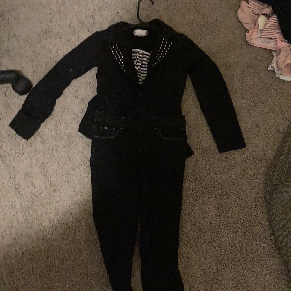 Black jeans black coat and black and white shirt!